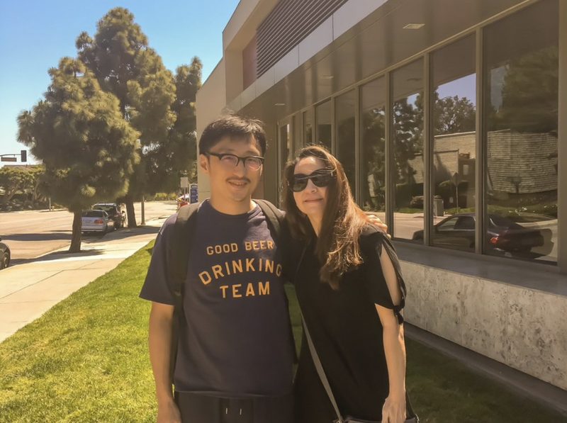 A student and teacher outdoors after class